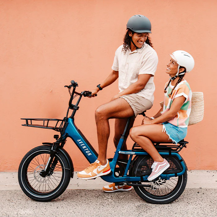 Father and daughter riding the Aventon Sinch.2.5 together on a quiet neighborhood street