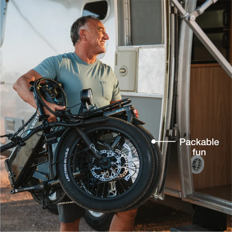 Wide all-terrain fat tires on the Lectric XP4 folding electric bike