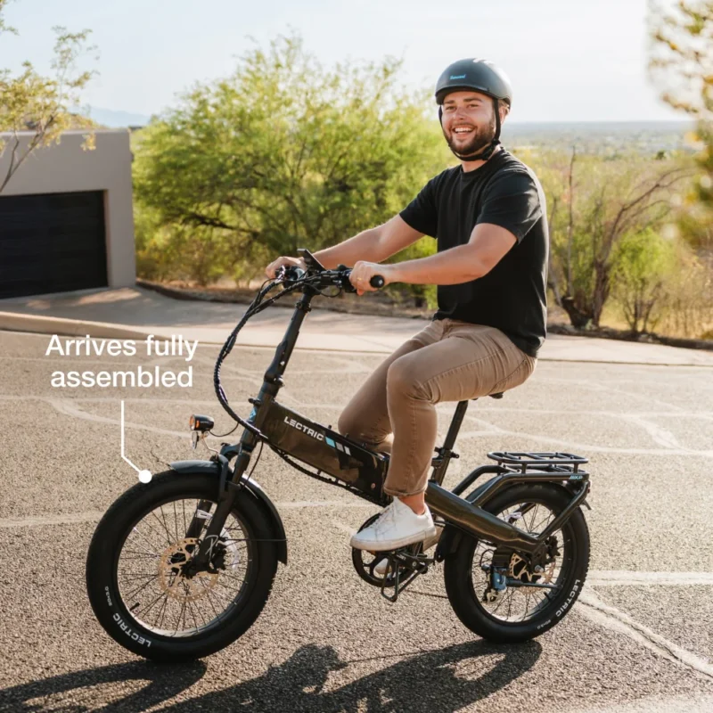 Premium Lectric XP4 folding electric bike parked outside a modern café