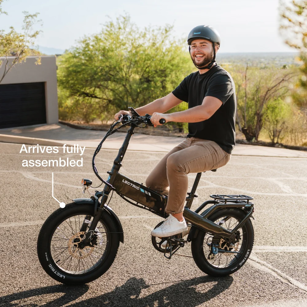 Premium Lectric XP4 folding electric bike parked outside a modern café