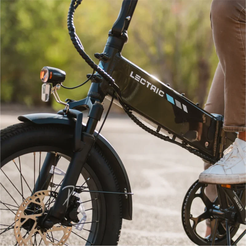 Lectric XP4 electric bike commuting through downtown city streets