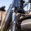 Front suspension fork on the RadCity 5 Plus Step-Thru electric bike absorbing road bumps