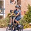 Lectric ONE electric commuter bike riding through an urban park