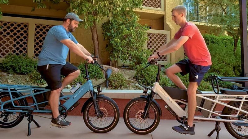 Lectric XPedition 2.0 electric cargo bike riding through downtown streets