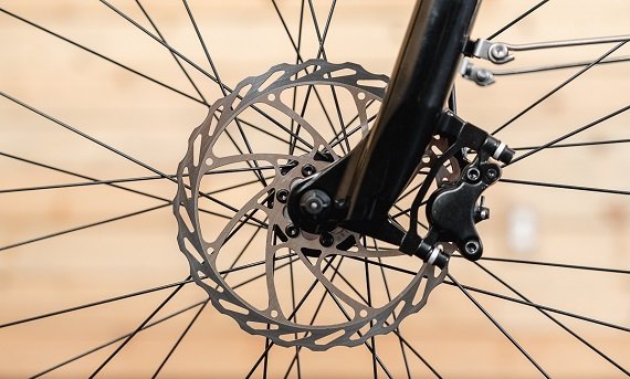 Front hydraulic brake rotor on the RadCity 5 Plus Step-Thru electric bike