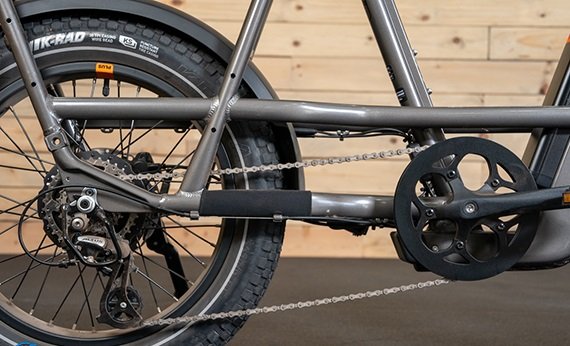 Close-up of the Shimano Altus drivetrain and rear derailleur on the RadRunner 3 Plus electric bike