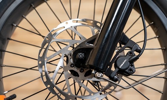 Oversized front hydraulic brake rotor on the RadRunner 3 Plus electric bike