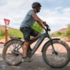 Aventon Aventure.3 electric bike riding along a scenic gravel path