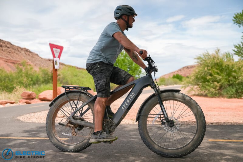 Aventon Aventure.3 electric bike riding along a scenic gravel path