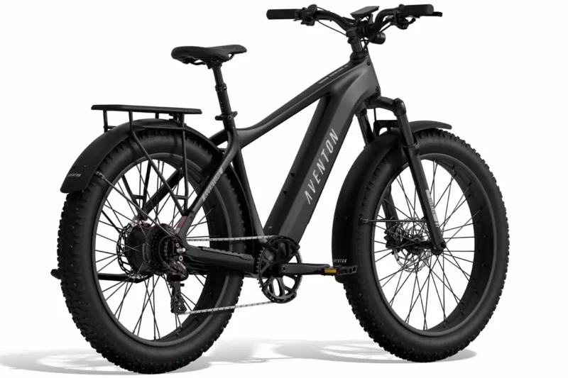 Aventon Aventure.3 Stealth fat tire electric bike riding off-road through rugged terrain
