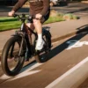 Modern commuter electric bike riding through a city street.