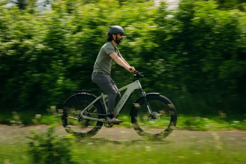 Rider exploring mountain trails on the Aventon Aventure.3 fat tire electric bike