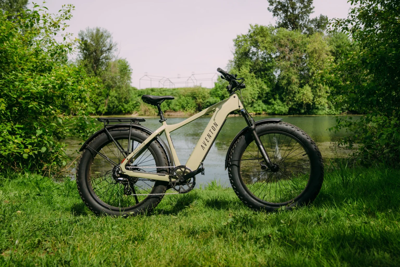 Aventon Aventure.3 all-terrain electric bike with front suspension, hydraulic brakes, and integrated lighting