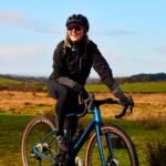 About RideNova EV team standing with premium electric bikes