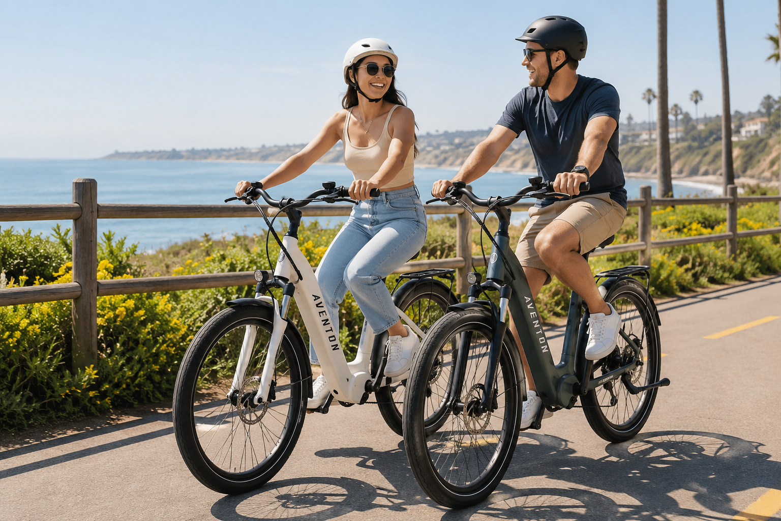 Couple enjoying a scenic ride on Aventon Pace 4 electric bikes along a beautiful coastal bike trail.
