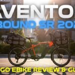 Ultra realistic 2026 Aventon Abound SR Cargo eBike on a sunny city street, fully loaded with cargo bags. YouTube thumbnail for review and guide video.