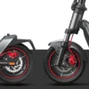 Side-by-side studio view of the front and rear wheels of an electric scooter highlighting the dual disc brakes.