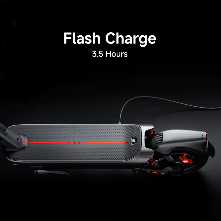 Top-down studio shot of the Segway electric scooter deck and folded rear wheel plugged into a charging cable against a dark background, overlaid with text reading "Flash Charge 3.5 Hours".