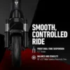 A direct front head-on view of the dark gray NIU KQi 200P electric scooter against a dark background with a red line on the ground. Text on the right reads "SMOOTH, CONTROLLED RIDE". Below, graphics and text describe the "FRONT DUAL-TUBE SUSPENSION" with 1.3" stroke and "BALANCE AND STABILITY" from "10" x 2.3" Wide Tubeless Pneumatic Tires".